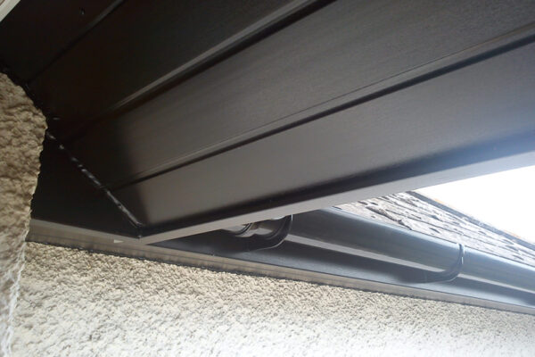 Fascia with soffit and guttering in black, in place of open eaves