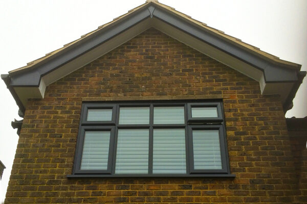 Grey fascia & bargeboard with white soffit and grey windows
