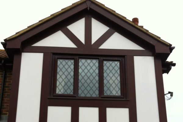 House with fascias, soffits and mock Tudor detail all in wood grain upvc