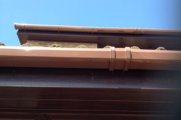 Rosewood cladding with brown guttering