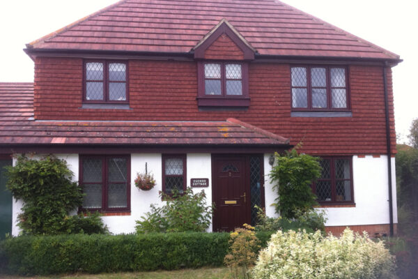 Rosewood fascia and bargeboards with white soffit