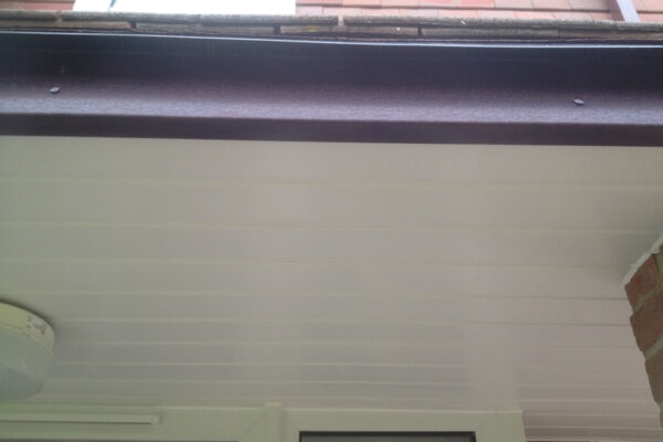 Rosewood fascia and white soffit in porch